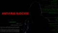 Dark hood man blocked antivirus, infecting computer system, cyber attack