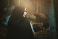 Dark hooded woman and hawk Royalty Free Stock Photo