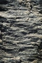 Dark horizontal folded stone