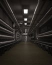 Dark industrial interior corridor with metal piping along the walls. 3D rendering in portrait format with copy space