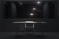 Dark interrogation room with switched-on lamp and big mirror, 3d rendering. Royalty Free Stock Photo