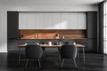 Dark kitchen room interior with four armchair and table