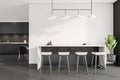 Dark kitchen room interior with four barstools, bar counter