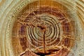 Dark knothole in a light grained piece of wood, close up, texture, background, pattern Royalty Free Stock Photo