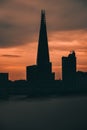 Dark late sunset over the city of London, orange sky showing silhouettes of Londons tall skyscrapers Royalty Free Stock Photo