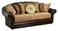 The dark leather sofa with pillows