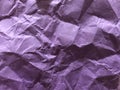 Dark and light purple board as crumpled foil gilding paper .