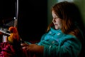 dark light in the teenage girl lying in bed playing a smartphone in social internet Royalty Free Stock Photo