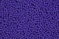 Dark lilac beads on macro, texture. Hi res photo.