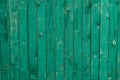 Dark lime vintage wooden boards. Backgrounds and textures fence painted. Front view. Attract beautiful vintage Royalty Free Stock Photo