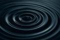 Dark liquid forming concentric circles after a drop impact Royalty Free Stock Photo