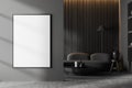 Dark living room interior with empty white poster, sofa, table Royalty Free Stock Photo