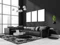 Dark living room interior with sofa and coffee table near window, mockup posters Royalty Free Stock Photo