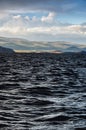 Dark low stormy clouds above the water, landscape before the storm Royalty Free Stock Photo