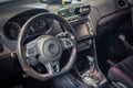 Dark luxury car Interior - steering wheel, shift lever and dashboard