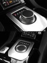 Dark luxury king Interior - Steering wheel, Shift Lever. Tuning. Karbon. Europe. Modern car automatic transmission. Interior Royalty Free Stock Photo