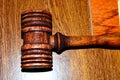 Dark Gavel on Medium Wood Grained Background