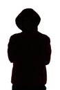 Dark male silhouette in casual sportswear with a hood, figure of a guy hiding his face, concept of privacy and confidentiality