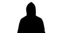 Dark male silhouette in hood looking into camera, preparing to attack, hooligan Royalty Free Stock Photo