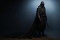 a dark man in a hooded cloak standing in front of a dark background Royalty Free Stock Photo