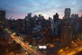 Dark Manhattan cityscape, colorful sunset