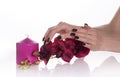 Dark manicure, purple orchid and candle