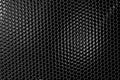 Dark metal honeycomb grid background Royalty Free Stock Photo