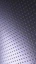 Dark metal phone wallpaper. Perforated aluminum surface with many holes. Tinted violet or purple industrial background. Vertical