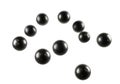 Dark metallic spheres scattered dynamically against a clean white background Royalty Free Stock Photo