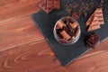 Dark and milk chocolate bars and pieces on black stone board. Royalty Free Stock Photo