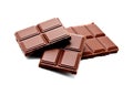 Dark milk chocolate bars stack isolated on a white Royalty Free Stock Photo
