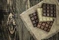 Dark , milk and white chocolate bar. Chocolate over rustic wooden background Royalty Free Stock Photo