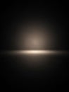 A dark, minimalist background with a soft, glowing horizontal light streak in the center creating a subtle, abstract, and Royalty Free Stock Photo