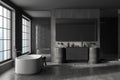 Dark modern bathroom interior with sink, tub and douche, accessories and window Royalty Free Stock Photo