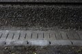 Railway verge under a bridge.