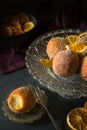 Dark moody food photography of donut spiced orange donut holes with sugar Royalty Free Stock Photo