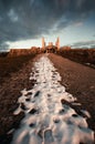 Dark and moody photo of Cairn of General Milan Rastislav Stefanik with snow covered path on sunset in Brezova pod Bradlom town.