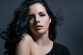 Dark moody portrait of a brunette beauty