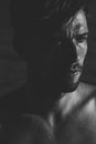 Dark moody portrait of an intense young man Royalty Free Stock Photo