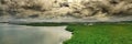 Dark and moody skies over the coastal tropical landscapes of Surigao Del Norte, Mindanao Philippines. Royalty Free Stock Photo