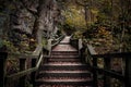 Dark moody wooden stairs and path leading through canyon rock formations Royalty Free Stock Photo