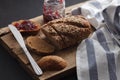 Dark multigrain bread whole grain and jam fresh baked on rustic