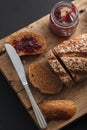 Dark multigrain bread whole grain and jam fresh baked on rustic Royalty Free Stock Photo