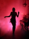 Dark silhouette in red smoke style retro woman. Girl dancing in vintage dress Royalty Free Stock Photo