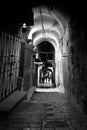 Dark mysterious vaults, black and white photo.Dark nightly narrow streets of the old city,