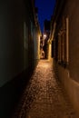 Dark narrow alley human silhouette