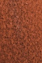Dark ocher background or wallpaper. Vertical textured backdrop. Rough matte surface. A toned shot of rusty iron. Rich, deep color