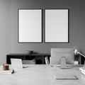 Dark office room interior with two empty white posters, desktop Royalty Free Stock Photo