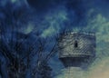 Old tower and spooky trees at night Royalty Free Stock Photo