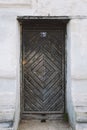 Dark old vintage wooden door with rusty metal handle Royalty Free Stock Photo